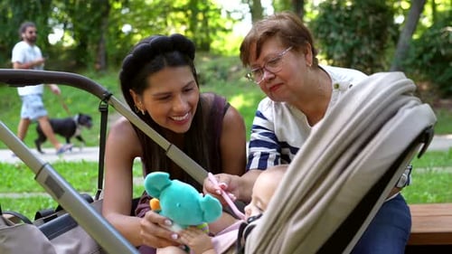 Latin Family Grandmother Mother and Granddaughter Playing in the Park