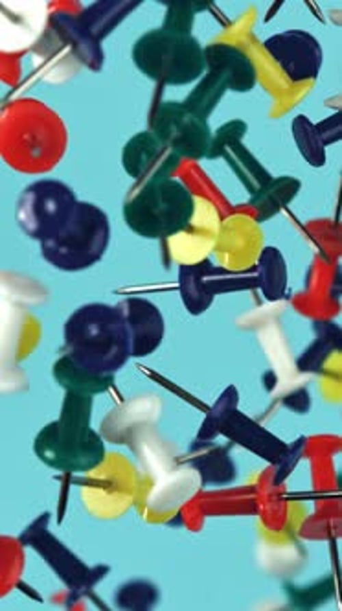 Multicolored Paper Clips Fly Up and Fall Down Filmed on a Highspeed Camera at 1000 Fps