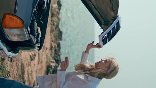 Woman Closing Car Hood Feeling Confused at Shore Girl Looking Breakage Vertical