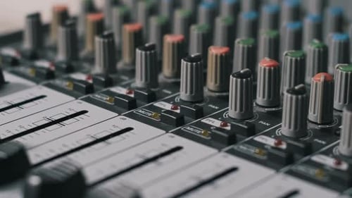 Audio Mixer Console with Knobs and Sliding Faders