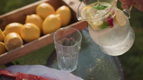 Refreshing Lemonade Pour With Fresh Lemons and Mint