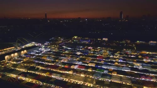 Panning Over Sunset in Bangkok Thailand and Colorful Night Market
