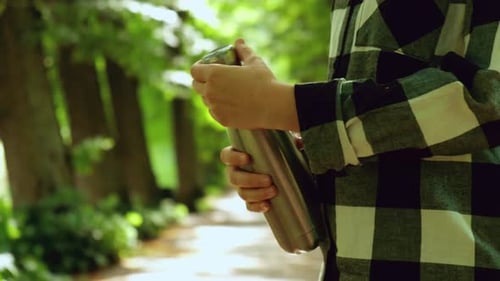 Closeup of Unrecognizable Female Hand Holding Water Bottle