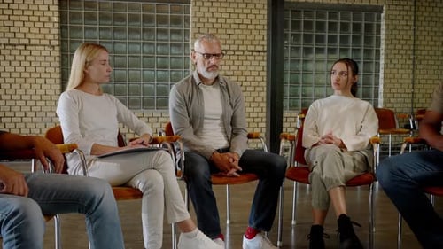 People Sitting in Circle for Therapy Session