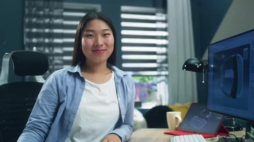 Woman Looking at Camera During 3D Modeling