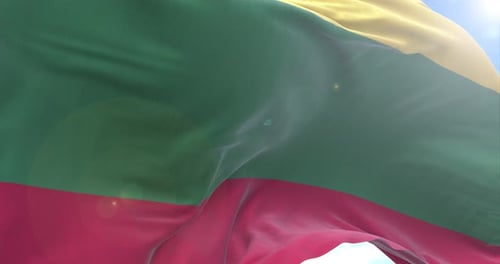 Realistic Lithuanian Flag Waving Against Blue Sky