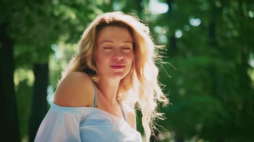 Joyful Moment in the Park with Bright Sunlight on a Summer Day