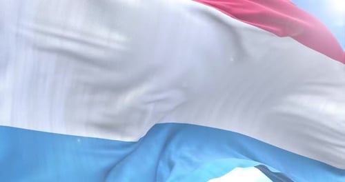 Realistic Waving Flag Against Blue Sky