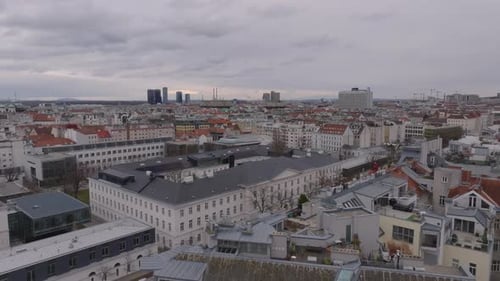 Forwards Fly Above Buildings in Urban Borough Aerial View of Metropolis on Cloudy Day Vienna Austria