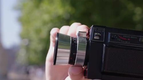 Cinematic shot of traveller using camera in London