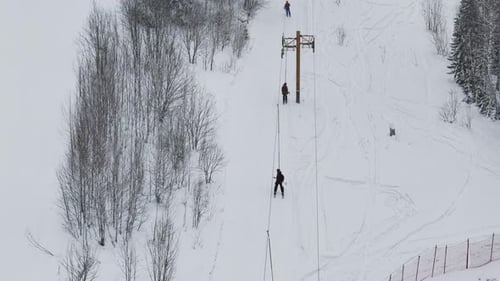 Ski Lift Rope Tow Snowy Ski Resort Rope Tow in Winter Forest Setting Aerial View Ski Lift Rope Tow