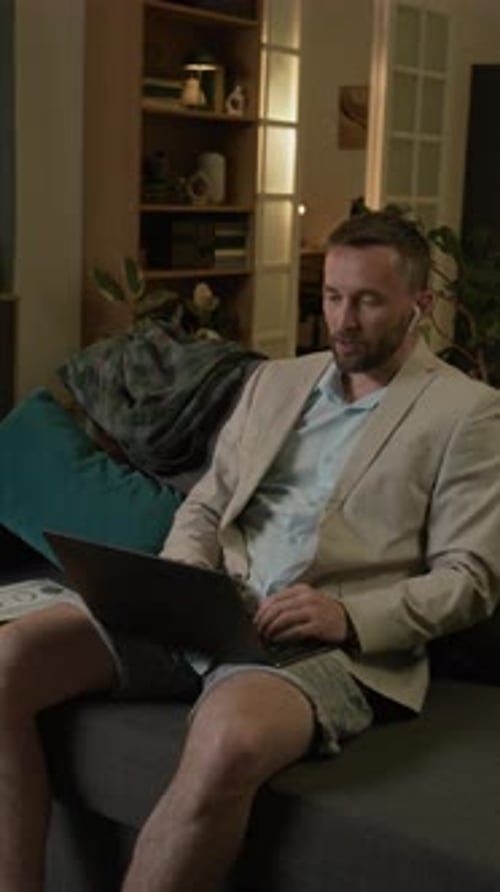 Man in Blazer, Shorts on Video Conference Call