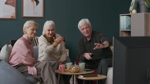 Three Silver Haired Friends Chat and Watch TV