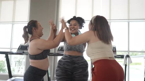chubby women workout at fitness center.