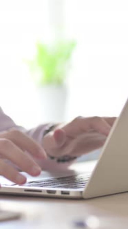 Close Up of Male Hands Typing on Laptop, Vertical Video