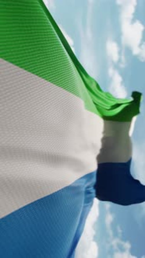 Realistic Sierra Leone Flag Waving in Bright Sky Vertical Video