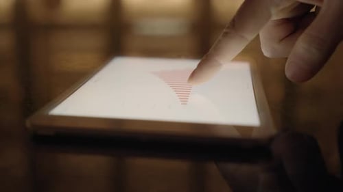 looking at financial business charts on modern touch pad device