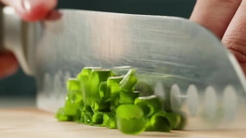 Cutting Fresh Green Onions on a Cutting Board Close Up Chef Cooking Green Vegan Salad