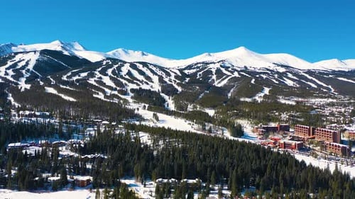 Aerial Drone Video of Ski Slopes on Breathtaking Mountainside. Lots of Trails for Winter Sports cove
