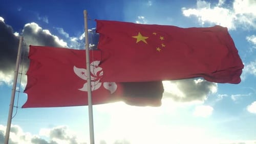 China and Hong Kong Flags Gently Waving in the Wind
