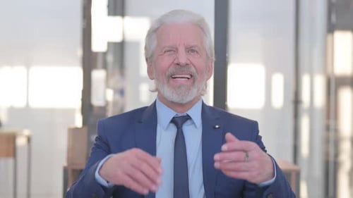 Portrait of Senior Old Businessman Celebrating Success in Office