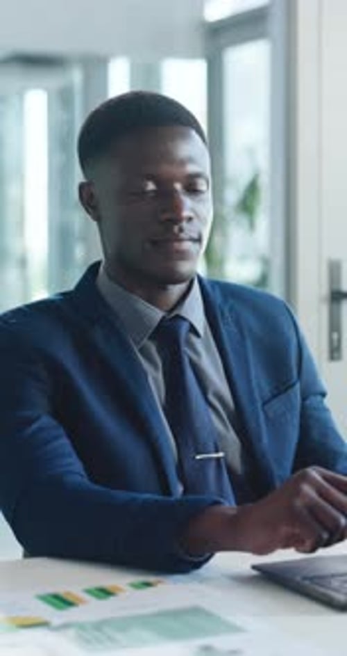 Face, office and business black man on laptop for profit growth, company expense and about us