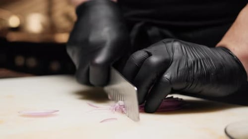 Chef Dices Red Onion with Gloves, Knife