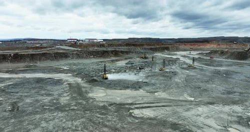 Quarry Mining Operations with Heavy Machinery and Dust Stock Clip