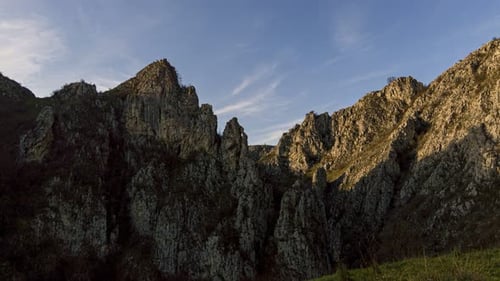 Mountain peek against cloudy sky