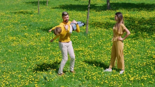Peaceful and Playful Family Moment in a Blooming Meadow