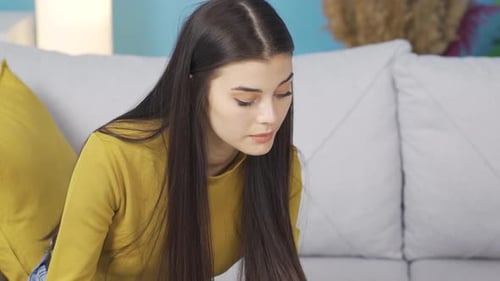 Woman Opens Laptop and Thinks at Home