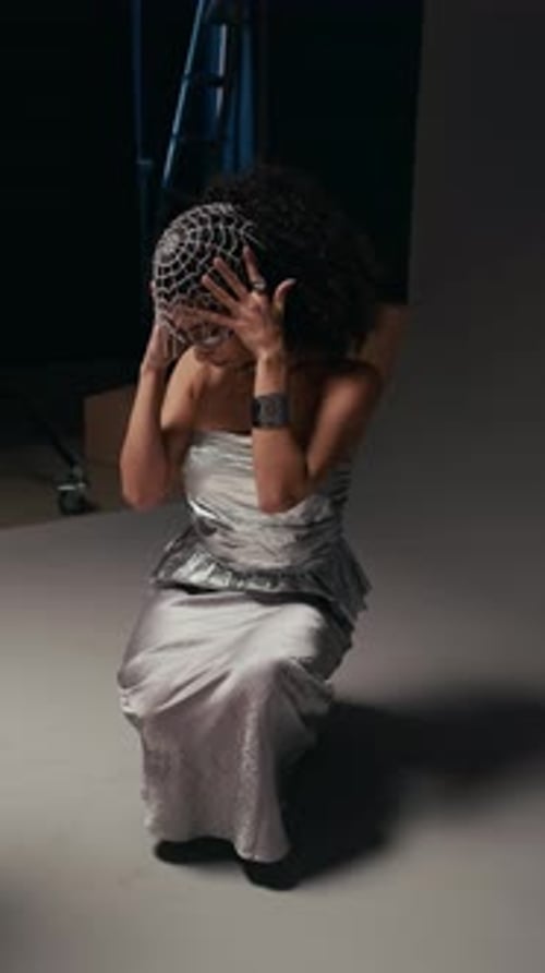 Backstage of Fashion Model Posing in Silver Gown in Photo Studio