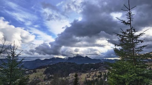 Rural Mountain Landscape with Trees and Meadows Fluffy Dramatic Clouds After Rain