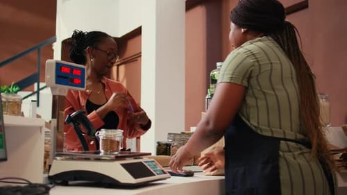 Woman Pays With Card at Modern Store