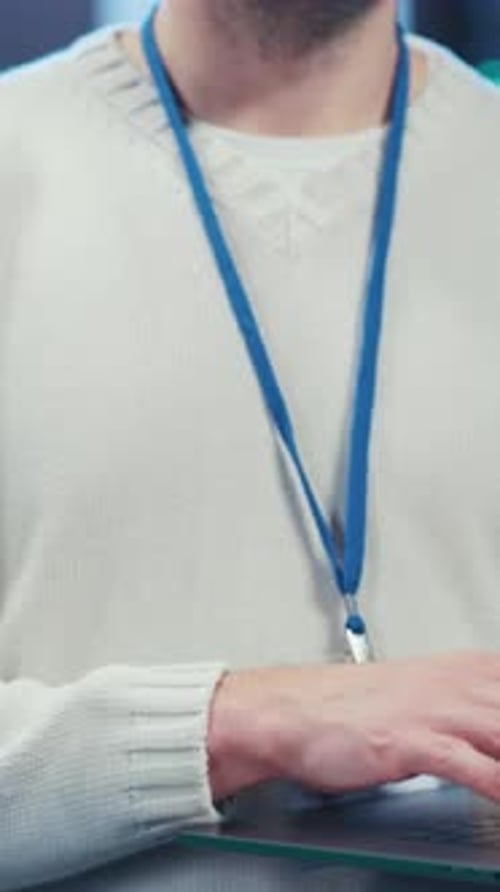 Man Standing in Server Room Looking at Camera