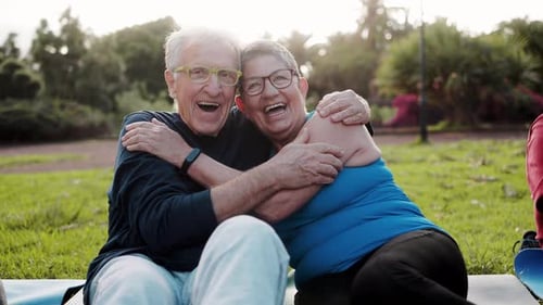 Happy senior couple having fun smiling in city nature. Older people enjoy together. Elderly