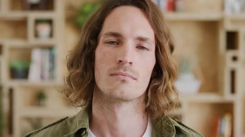 Creative, office and face of a professional man standing in his startup company for web development