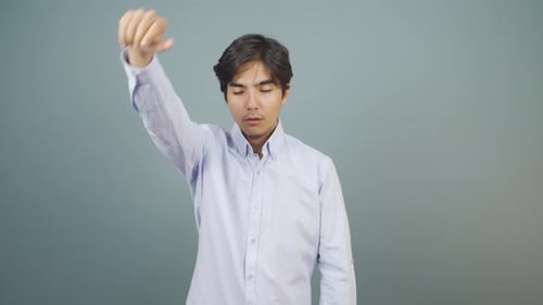 Man Gesturing Because He is Hot and Sweaty