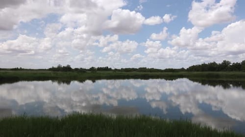 nice blue lake with cloudy sky in the background