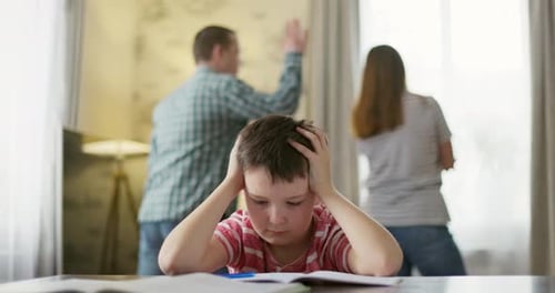 A Son Feels Frustrated While His Parents Fight in the Background