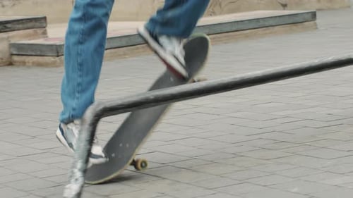 Young Skater Making 360 Flip Jump Performing Kickflip Trick Skateboarder Training in Skatepark