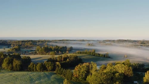 Rural Landscape with Mist at Golden Sunrise