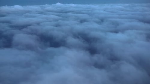 Aerial View of Clouds Over Vast Landscape