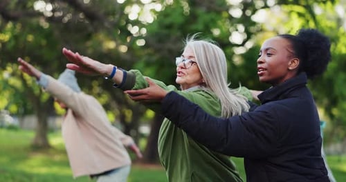 Yoga class, park and senior people with instructor exercise together in nature for health