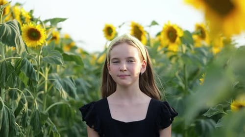 Girl Posing in a Sunny Sunflower Field