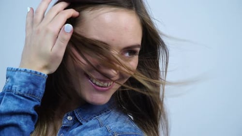 Smiling Woman Posing in Minimalist Setting