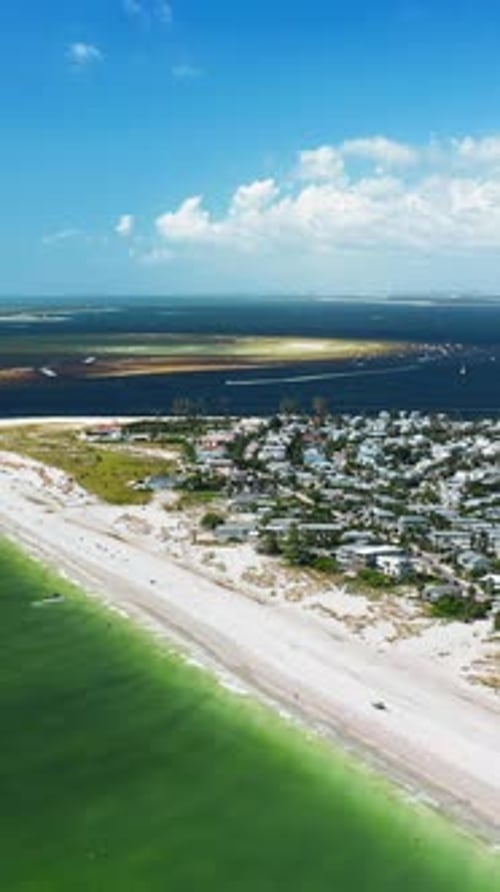 Aerial View of Beachfront Community on a Sunny Day