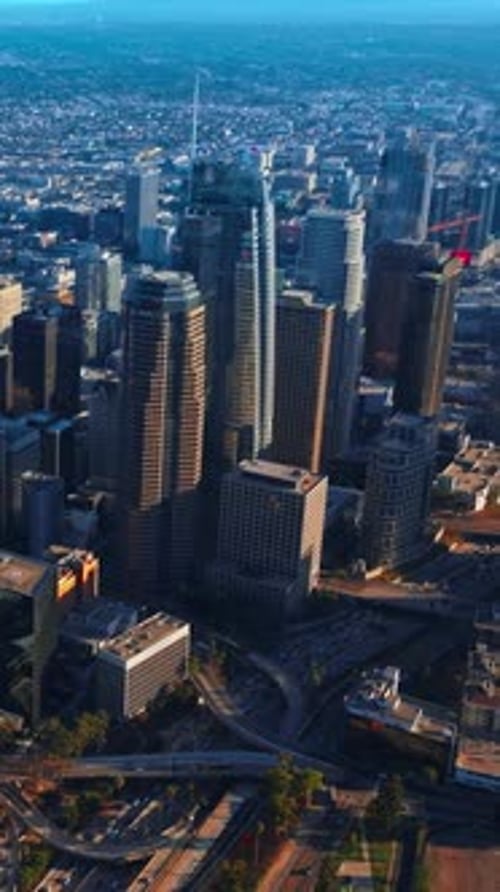 Marvelous Los Angeles skyscrapers in financial downtown. City scenery with hazy horizon at backdrop.