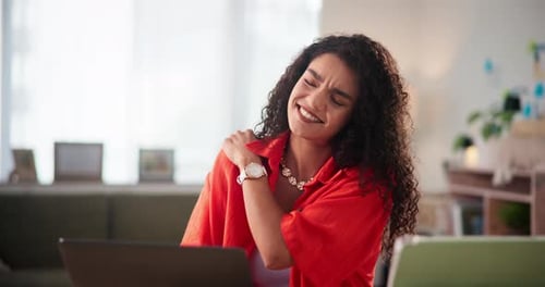 Woman Massaging Sore Shoulder at Desk