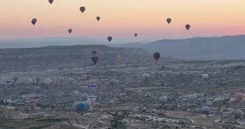 Aerial Cinematic Drone View of Colorful Hot Air Balloon Flying Over Cappadocia